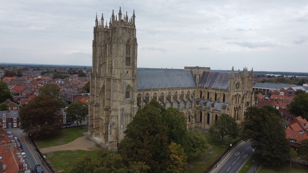 Aerial view of Beverly Minister surrounded by residential rooftops.